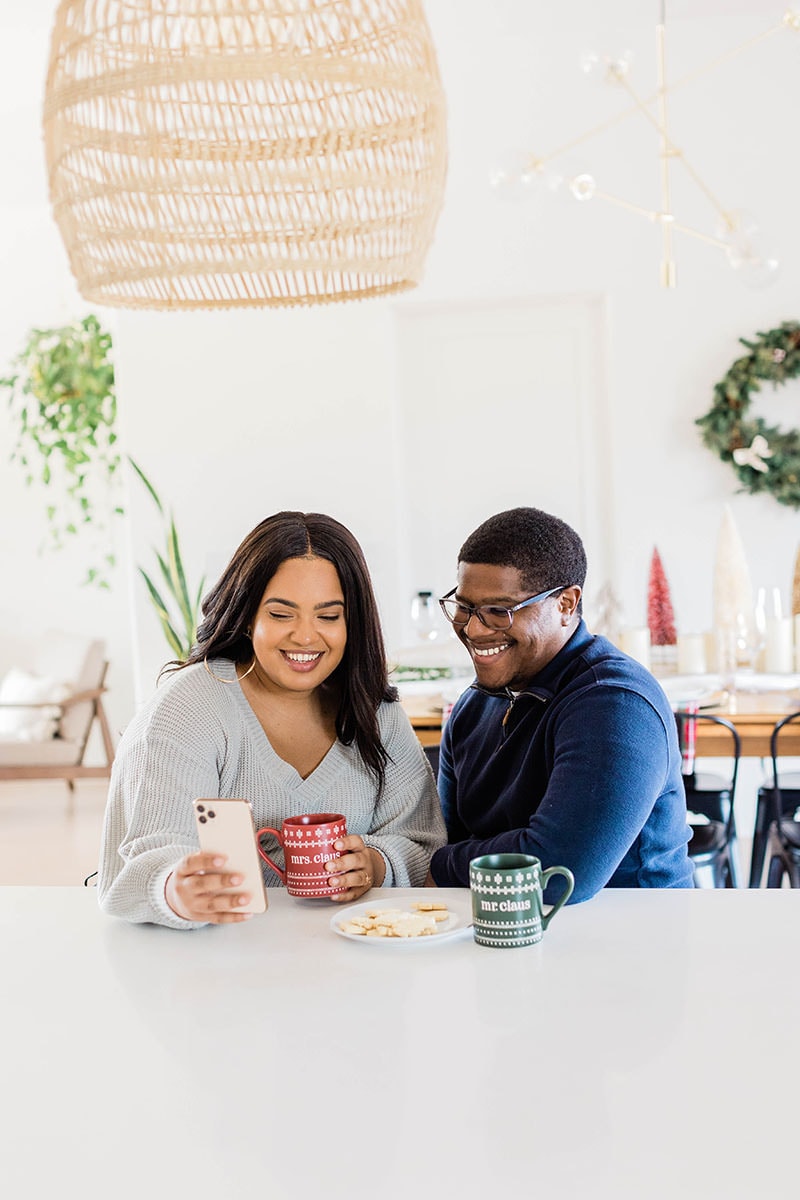 Couple laughing at kitchen counter