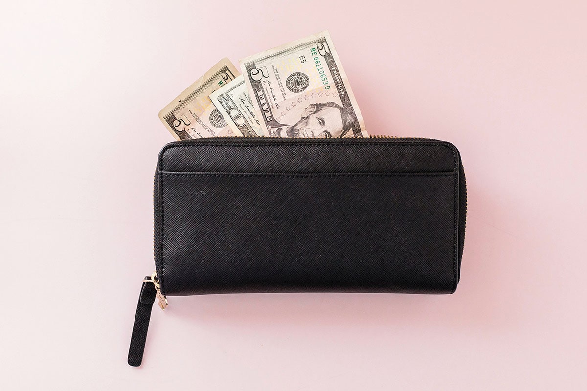 Financial Independence 4 - Money bills in black wallet