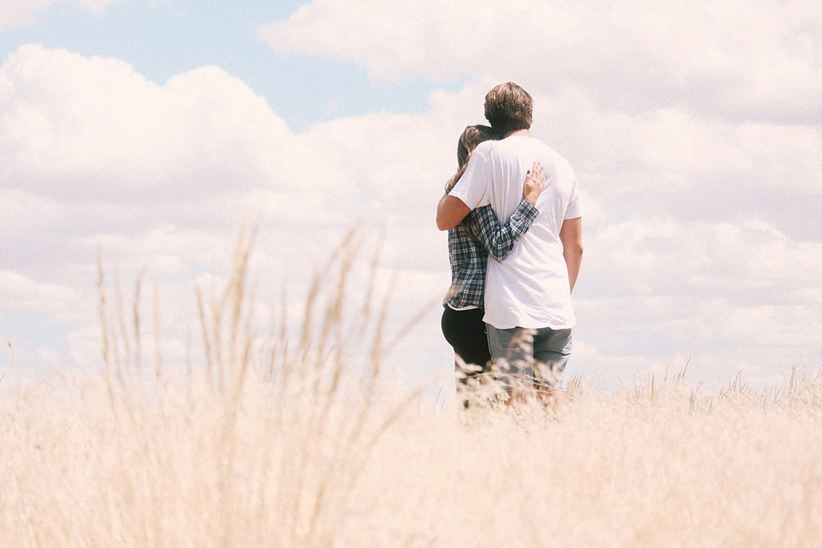 Relationship Rituals 3 - Couple hugging in a field