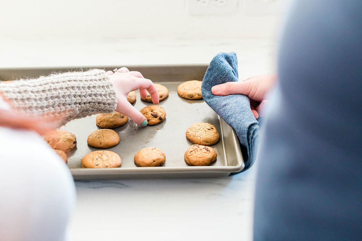 Couple with tray of freshly baked cookies
