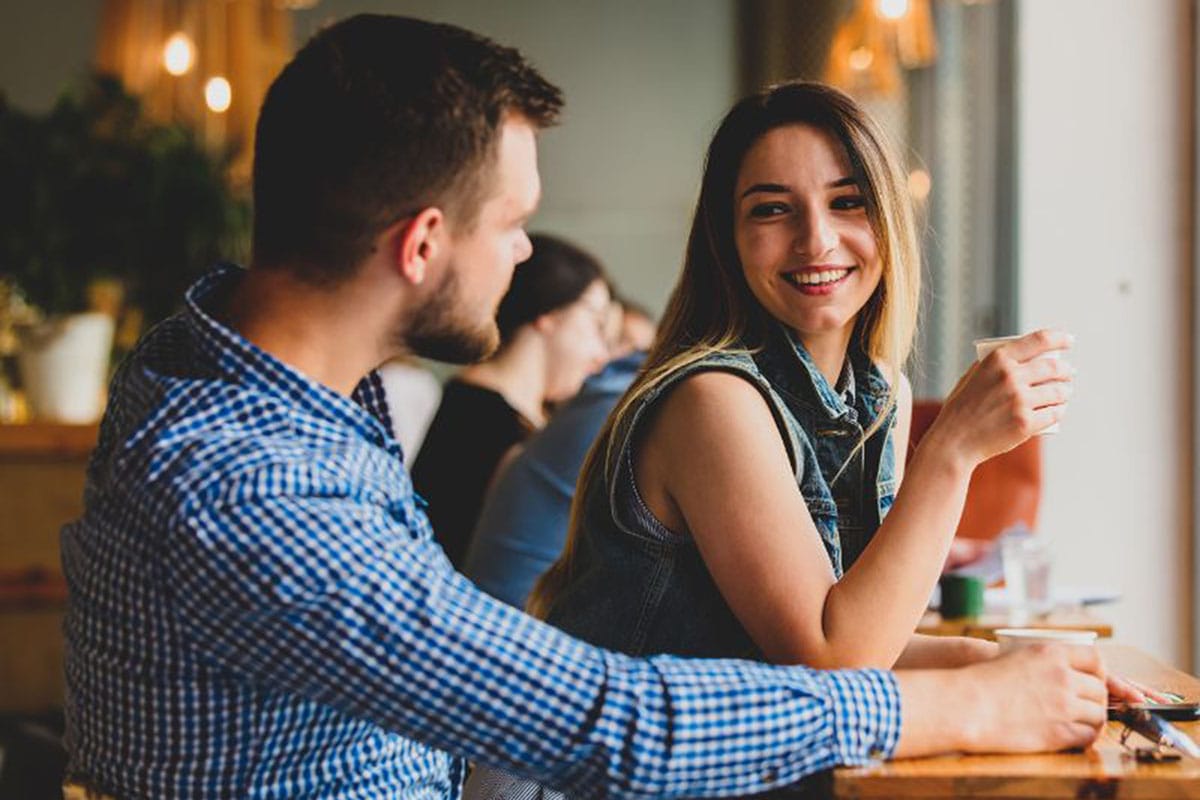 Couple chatting at a restaurant counter