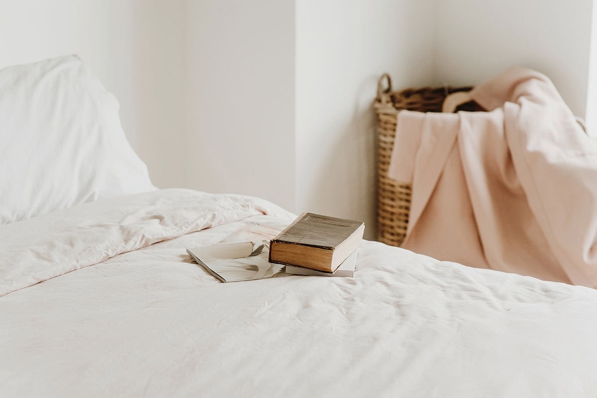 Books lying on a bed