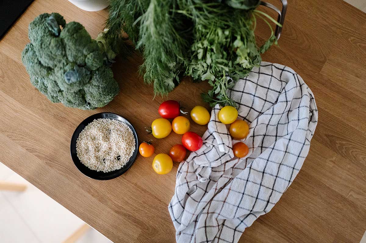 Fresh vegetables on wooden kitchen counter