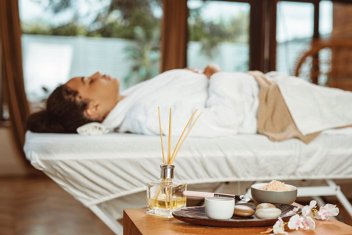 Woman at spa lying on massage table