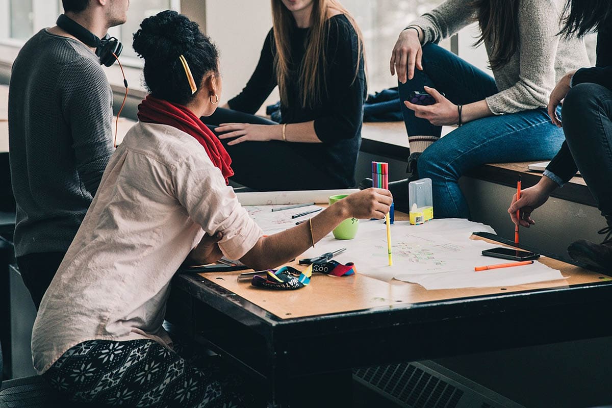 Adult Friendships are Hard | Group of adults sitting around a worktable